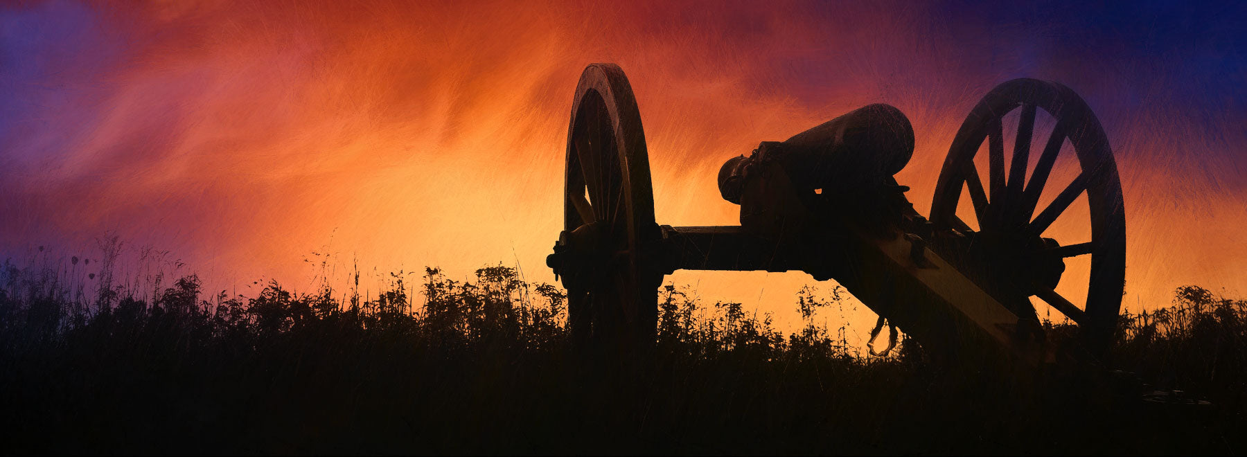 New Releases - Cannon silhouette against sunset.