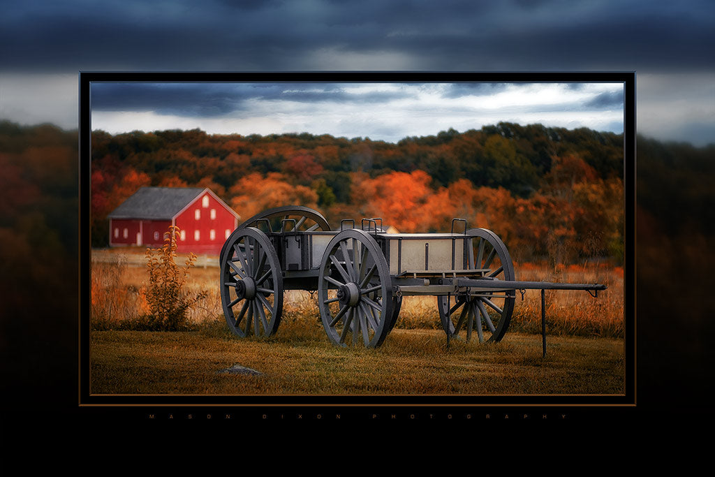 This glossy 6&quot; x 9&quot; aluminum print features a caisson at the Angle in Gettysburg National Military Park, with a red barn in the background.